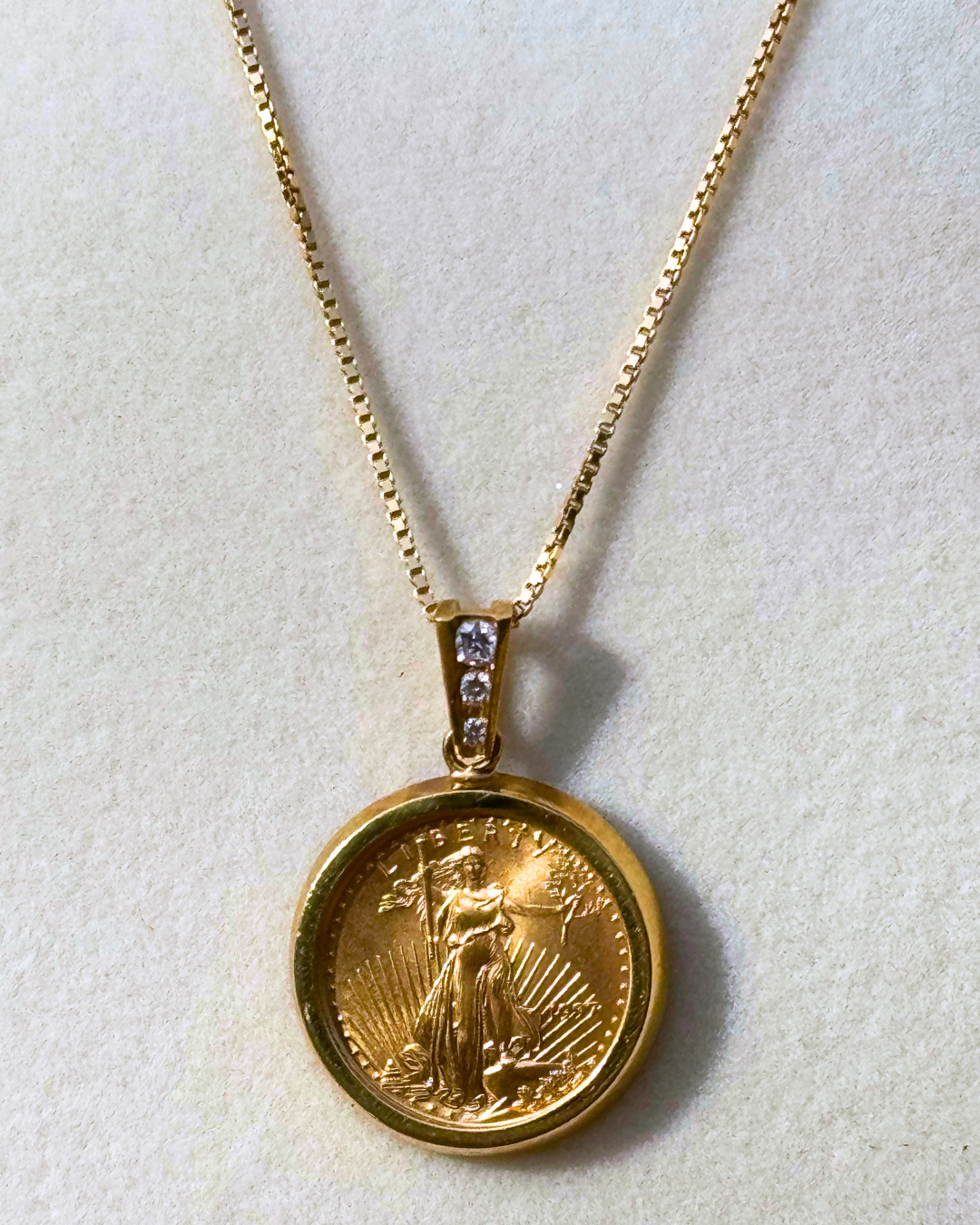 American Eagle Gold Coin Pendant 1/10 oz, 22 KT Encased in Diamond Studded Bail